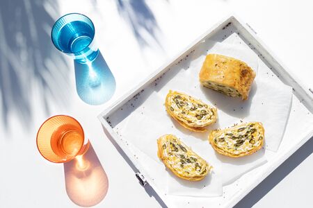 Modern appetizer with vegan rolls in natural light and pastel colors.の写真素材