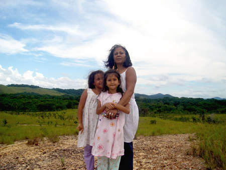 El Retumbo Sector, BolÃ­var State, Venezuela, 08/25/2007,
Venezuelan lady accompanied by two girls.のeditorial素材