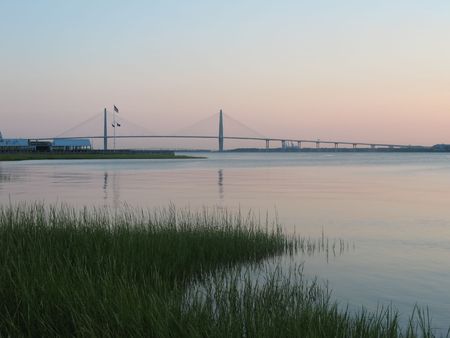 Marsh and river with Charleston bridgeの写真素材