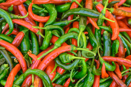 fresh appetizing red and green hot peppers at the bazaar on the island of Cyprus in autumnの写真素材