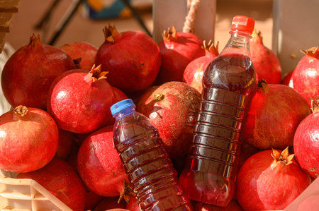 beautiful fresh pomegranates and pomegranate juice in a pile at a local market in the Mediterranean 2の写真素材