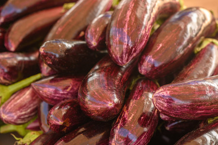 beautiful fresh eggplants in a pile at a local market in the Mediterraneanの写真素材