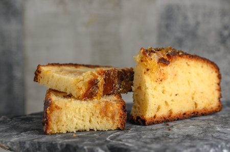 piece of pie with orange jam on a stone kitchen surface 4の写真素材