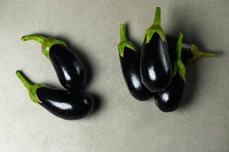 appetizing eggplants on a stone backgroundの写真素材
