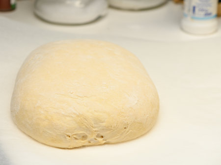 dough for homemade bread lies on the kitchen table before going into the oven 8の写真素材