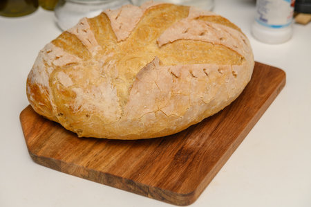 freshly baked homemade bread on the kitchen table on a light background 9の写真素材