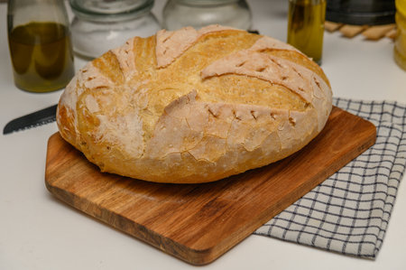 freshly baked homemade bread on the kitchen table on a light background 4の写真素材