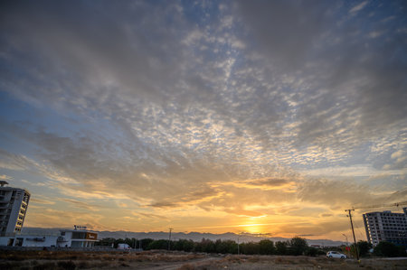 sunset sky on the island of Cyprus, colorful clouds and reflections in the skyの写真素材