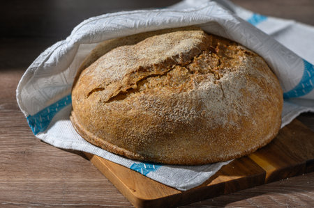 homemade whole grain bread in the kitchen on a wooden table