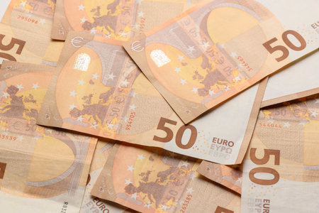 Pile of 50 euro notes business background.