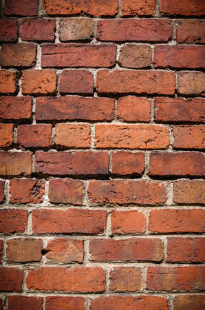 Red brick wall. Texture of old dark brown and red brick wall