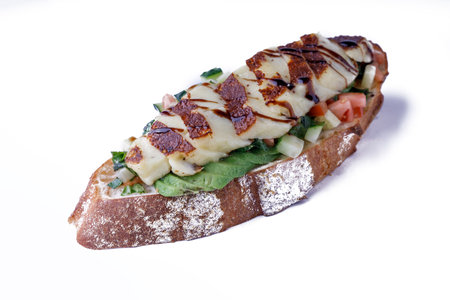 Delicious bruschetta with tomatoes on a plate on a white backgroundの写真素材