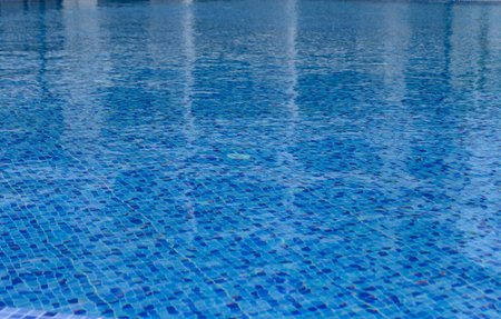 Swimming Pool Surface With Light Reflection and Water Ripple Patterns