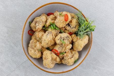 mushrooms in batter on a stone background studio food photoの写真素材