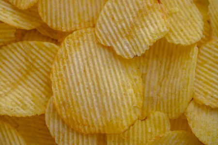 Full frame food background of potato chips, top viewの写真素材