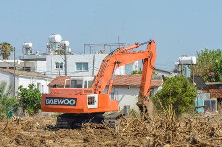 Gazeveren Cyprus 07/03/2024 - excavator uproots the roots of orange trees