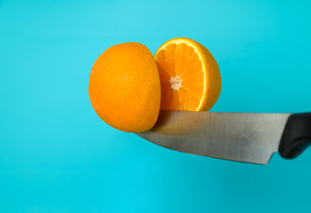 cuts orange on blue backgroundの写真素材