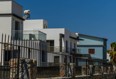 Residential townhouses on blue sky background on sunny day.の写真素材