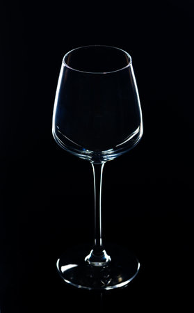 Silhouette,Close-up of wineglass against black backgroundの写真素材