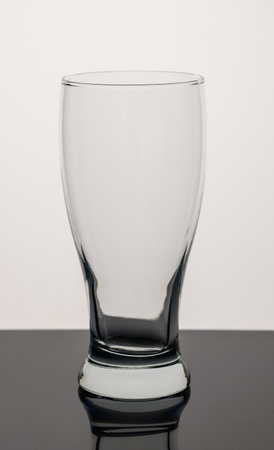 Empty Pint Beer Glass Isolated on white backgroundの写真素材