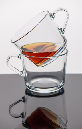 A set of tea cups with black teaの写真素材