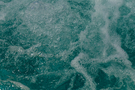 A blue pool shines on a summer dayの写真素材