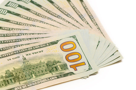 Dollar bills,Close-up of paper currency against white background 1の写真素材