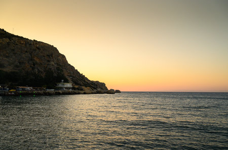sunset on a Mediterranean coastal beachの写真素材