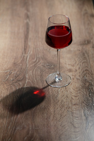Close-up of red wine in glass on table