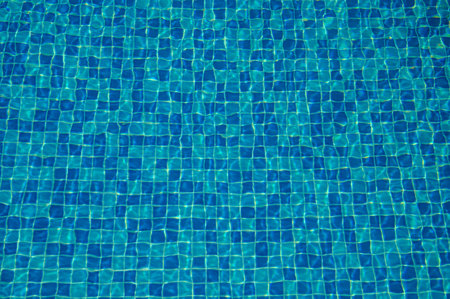 Beautiful sun reflections of water in the pool. Summer. Flight holidays