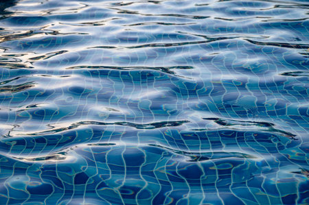Beautiful sun reflections of water in the pool. Summer. Flight holidays.の写真素材