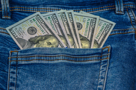 dollars in a jeans pocket, closeup
