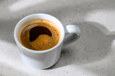 Close-up of coffee cup on tableの写真素材