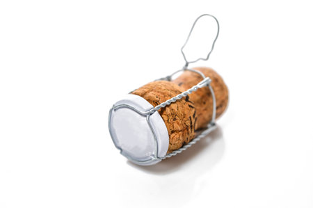 Macro photo of an isolated champagne or sparkling wine cork. Concept object for a celebration event.
