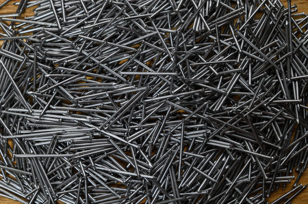 Pile of small gray metal nails. Close-upの写真素材