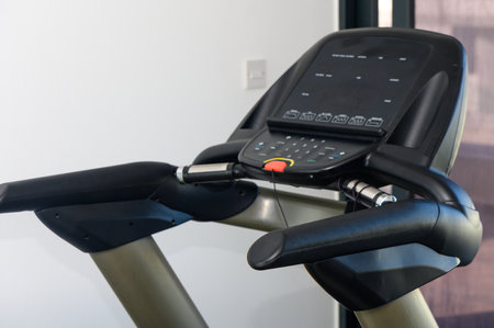 Treadmill and Cross Trainers Side by Side in Gym