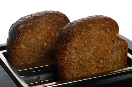 Warm, golden-brown slices of whole grain toast are ready to be enjoyed, adding flavor to a morning...