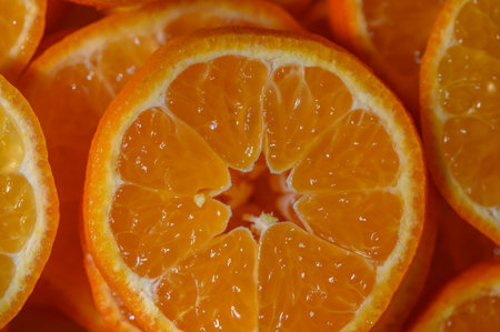 Juicy orange slices beautifully arranged, revealing vibrant colors and refreshing texture, perfect...