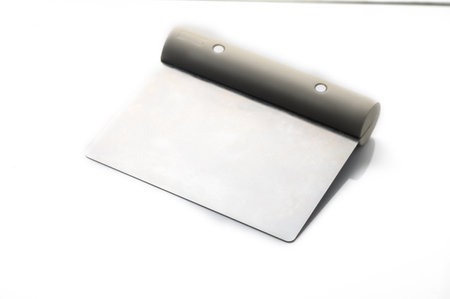 A stylish notepad with a distinctive curved binding rests on a smooth surface, inviting ideas and inspiration.の写真素材