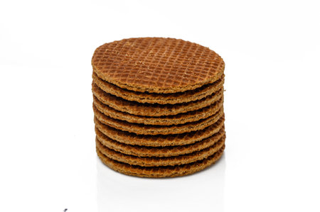 Stacked wafers create an enticing display, highlighting their crunchy texture and sweet caramel filling.の写真素材