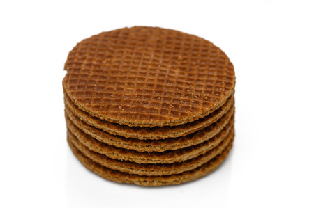 Stacked caramel waffles create a tempting treat perfect for satisfying sweet cravings during any cozy moment.の写真素材