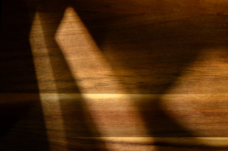 Intricate patterns of light and shadow blend harmoniously, evoking a sense of tranquility and warmth in the evening.の写真素材