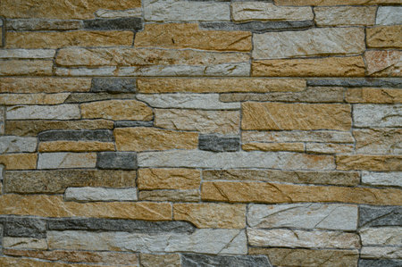 An intricate stone arrangement adds a cozy, earthy vibe with varied textures, ideal for interior...