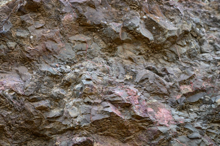 Weathered rock layers showcase unique textures and colors, highlighting the beauty of nature's...