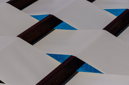 Sunny striped canopy with wooden planks background