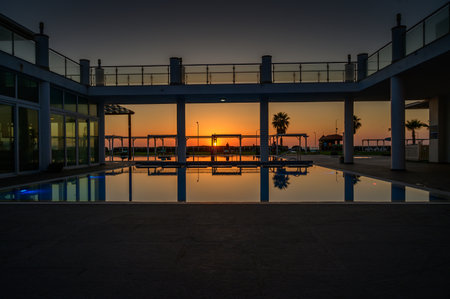 Sunset Over the Sea and Pool in Cyprusの写真素材