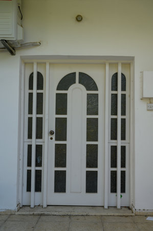 Old White Wooden Door on a Traditional Cypriot Houseの写真素材