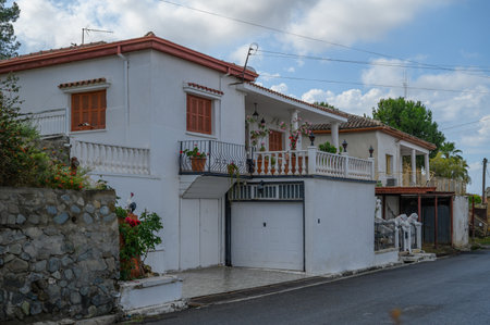 Old Cypriot Street with White Walls and Blue Shuttersの写真素材