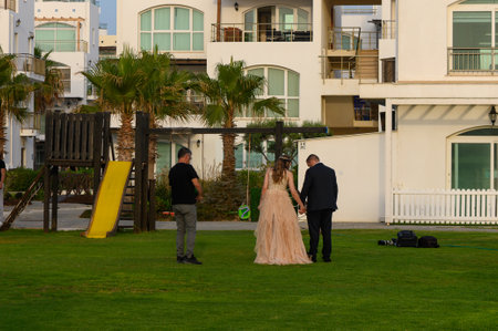 Bride, Groom and Photographer During Wedding Photoshoot in Cyprusの写真素材