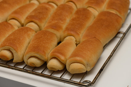 Freshly Baked Parker House Rolls on Kitchen Countertop Coolingの写真素材